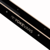 Close-up of a black textured strap with rose-gold edging and the brand name YOKEVANS printed along its length.