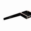 Angled black metal frame with wooden side rails forming a rectangular end, labeled YOKE VANS; appears to be a hardware tool component